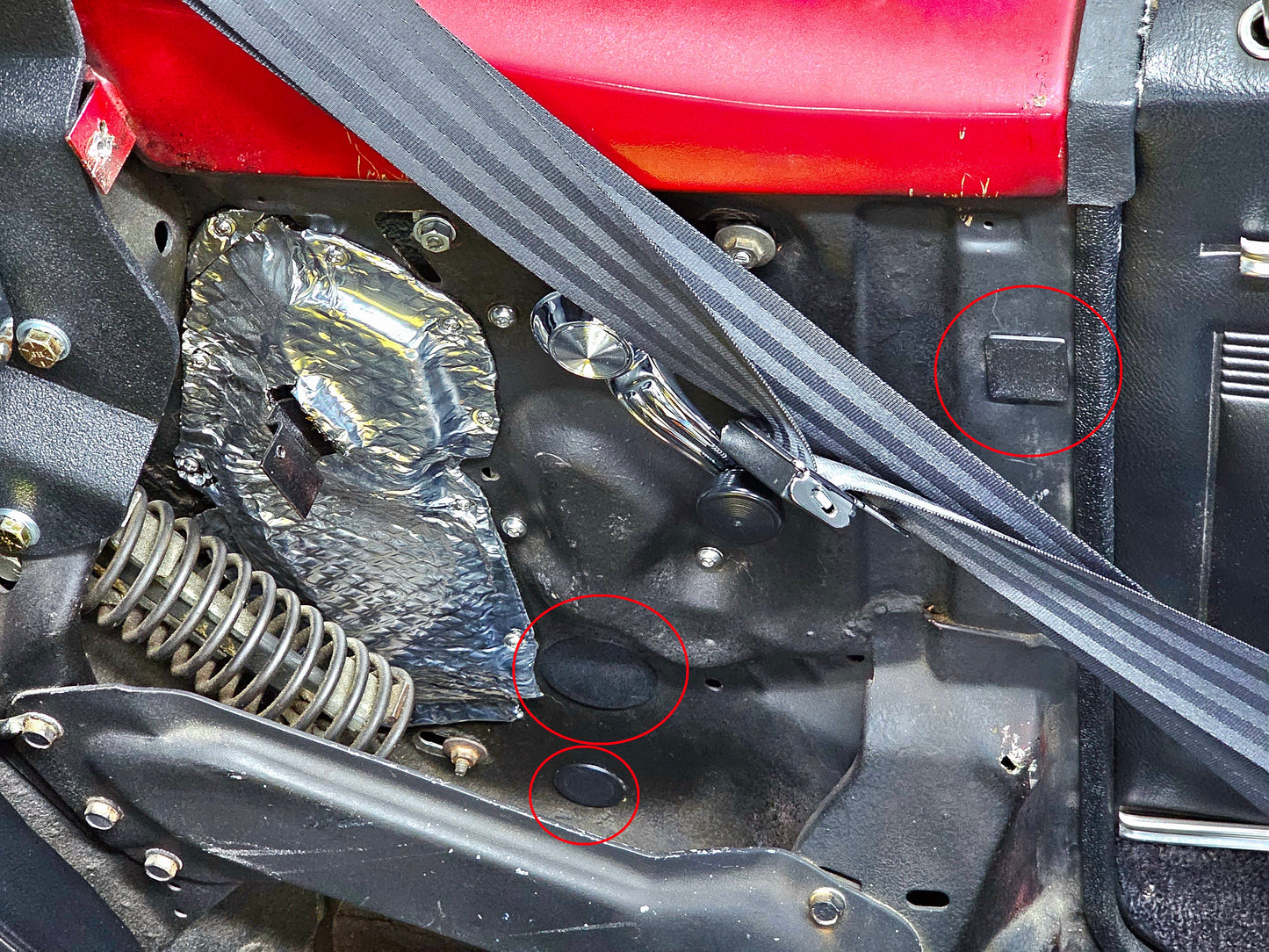 A picture of installed PETG 1967-1969 Firebird/Camaro Convertible Rear Quarter Interior Dust Plug Seals on the driver side of a 1968 Firebird Convertible.